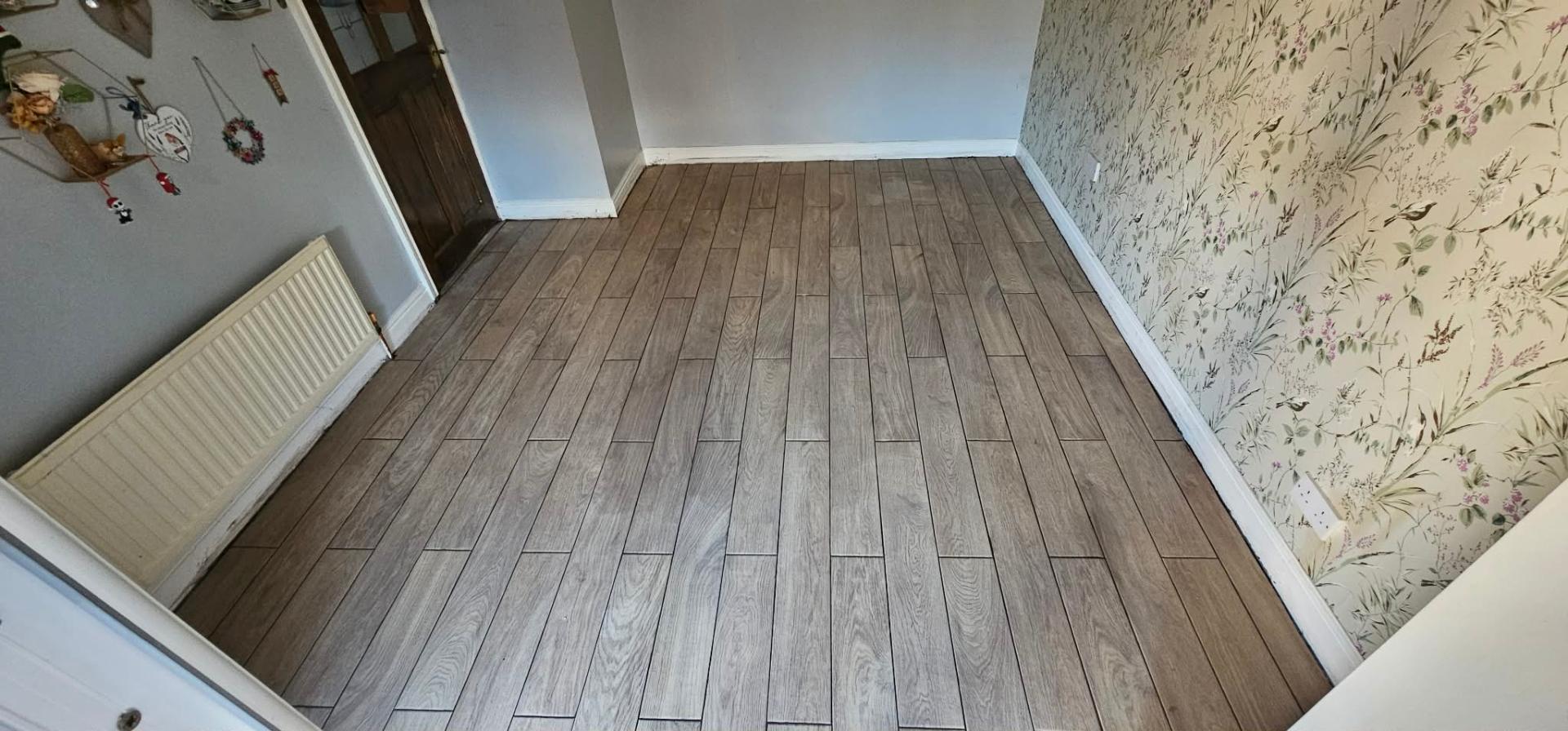 Oak laminate flooring completed by IDL Property Services